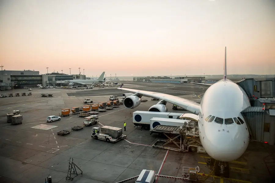 image of workers loading a cargo plane